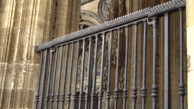 Metal fence and patterns on the wall at the entrance to the Catedral in Oviedo