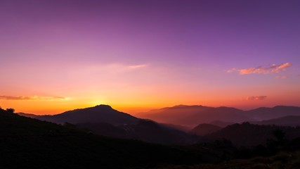 Fototapeta na wymiar Beautiful landscape purple sky and sunrise on the mountain with foggy.