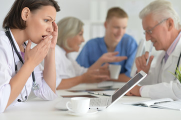 Portrait of professional doctors working in cabinet