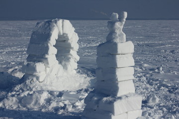 Winter landscape with ice igloo on white snow background.