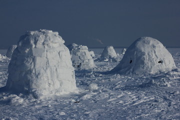 Winter landscape with ice igloo on white snow background.