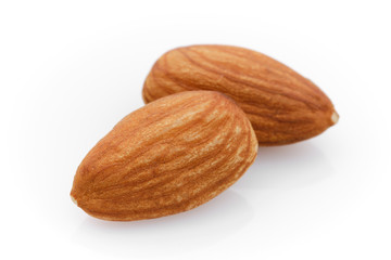almonds isolated on white background close up. macro shot
