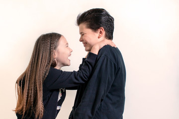 little girl and boy laughing