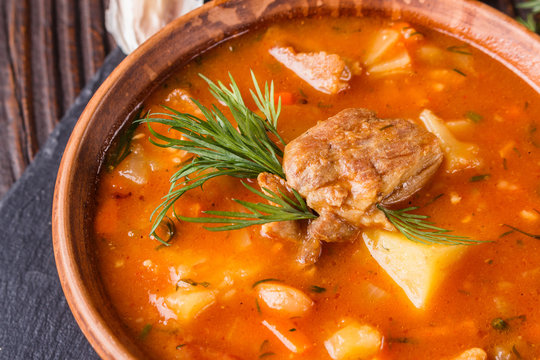 Chanahi a traditional Georgian meat stew in a bowl on stoyn board