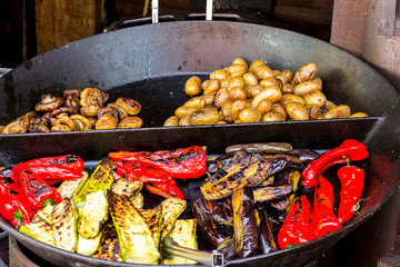 Varied grilled vegetables close up. Background of vegetables on the grill.