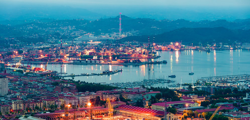 Aerial spring view of port and city of La Spezia. Colorful sunrise of Mediterranean sea, Liguria, Italy, Europe. Magnificent Mediterranean landscape. Traveling concept background.