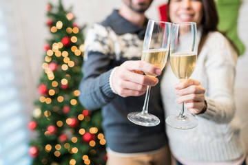 Lovers With Champagne Flutes At Home