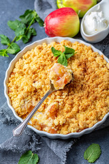 Homemade apple crumble with cinnamon.