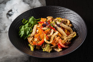 seafood dish on the black background