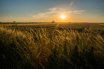 Mont Saint-Michel Bay and Golden Fields in Normandy France at Sunset