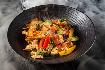 meat with grilled vegetables and sauce