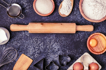 Ingredients for baking  - flour, wooden spoon, rolling pin, eggs