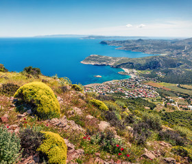 Fototapeta na wymiar Colorful morning view of Paralia Kakis Thalassis village. Bright spring seascape of Aegean sea. Sunny morning scene of the Greece, Europe. Beauty of nature concept background.