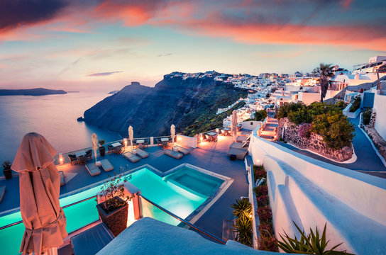 Fantastic evening view of Santorini island. Picturesque spring sunset on famous Greek resort Fira, Greece, Europe. Traveling concept background. Artistic style post processed photo.