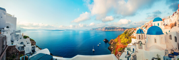 Sunny morning panorama of Santorini island. Colorful spring view offamous Greek resort Fira,...