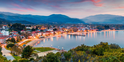 Picturesque spring scene of Aegean sea. Dramatic sunset of Olimpiada town, Greece, Europe. Traveling concept background. Active tourism concept background.