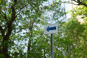 the arrow sign on the street entrance or exit