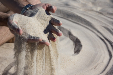 Beautiful white sand in hands on sardinian beach - 288750655