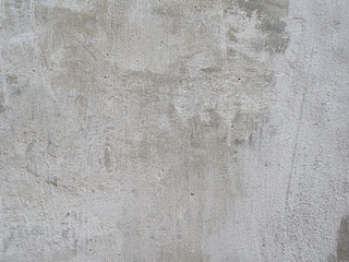 old concrete surface with a lot of scratches and damage. background