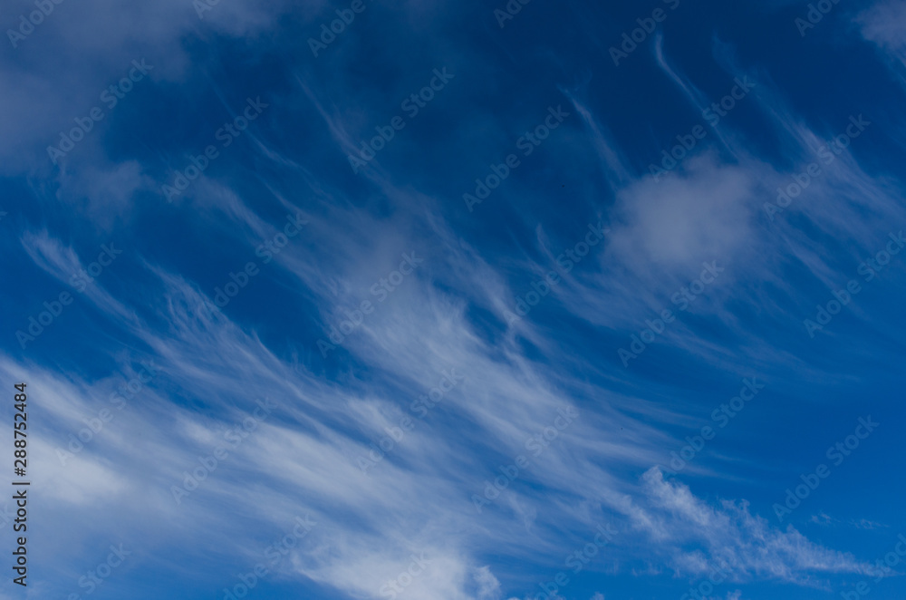 Sticker Beautiful forms of clouds on blue sky