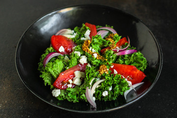 Healthy salad, leaves mix salad (mix micro greens, cucumber, tomato, onion, other ingredients). food background. copy space