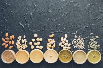 Nuts and seeds butter in glass jars
