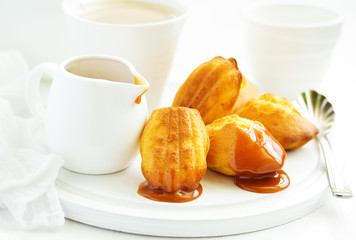 Madeleine french cookies with caramel. selective focus.