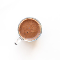 Сup of coffee isolated on white background. View from above.