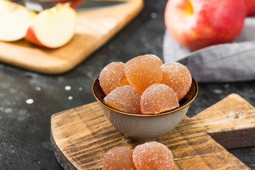 Apple marmalade in a grey bowl on a black table