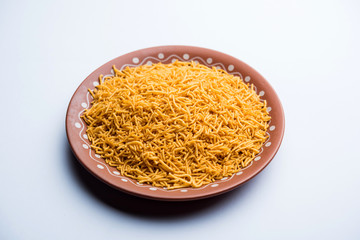 Aloo Bhujiya or Potato Bhujia also known as Namkeen sev. Popular Bikaneri recipe served in a bowl or plate. selective focus