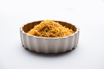 Aloo Bhujiya or Potato Bhujia also known as Namkeen sev. Popular Bikaneri recipe served in a bowl or plate. selective focus