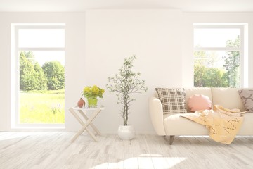 Stylish room in white color with sofa and summer landscape in window. Scandinavian interior design. 3D illustration