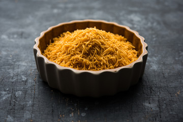 Aloo Bhujiya or Potato Bhujia also known as Namkeen sev. Popular Bikaneri recipe served in a bowl or plate. selective focus