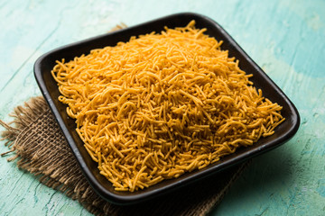 Aloo Bhujiya or Potato Bhujia also known as Namkeen sev. Popular Bikaneri recipe served in a bowl or plate. selective focus