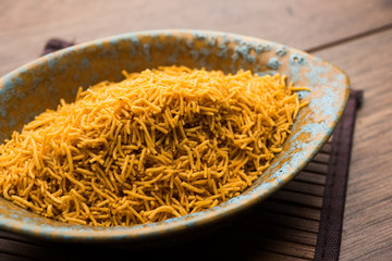 Aloo Bhujiya or Potato Bhujia also known as Namkeen sev. Popular Bikaneri recipe served in a bowl or plate. selective focus