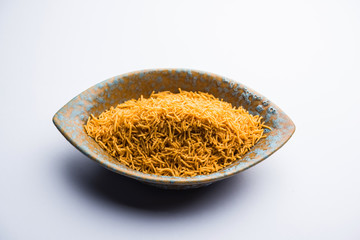 Aloo Bhujiya or Potato Bhujia also known as Namkeen sev. Popular Bikaneri recipe served in a bowl or plate. selective focus