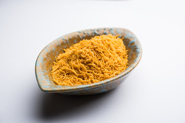 Aloo Bhujiya or Potato Bhujia also known as Namkeen sev. Popular Bikaneri recipe served in a bowl or plate. selective focus
