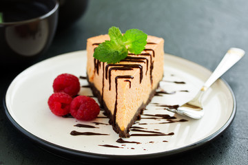 Pumpkin cheesecake with raspberries. Selective focus.
