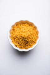 Aloo Bhujiya or Potato Bhujia also known as Namkeen sev. Popular Bikaneri recipe served in a bowl or plate. selective focus