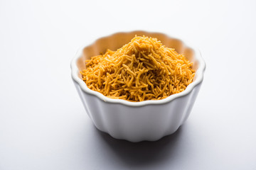 Aloo Bhujiya or Potato Bhujia also known as Namkeen sev. Popular Bikaneri recipe served in a bowl or plate. selective focus