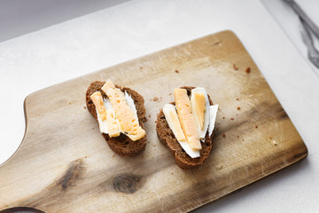 morning sandwiches with coffee. bread with cheese and butter.