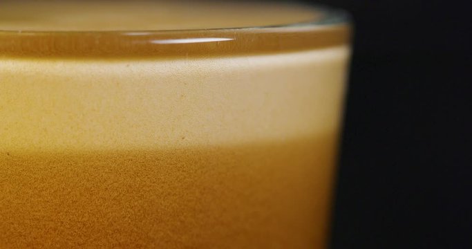 Close-up of strong espresso from high-end coffee machine