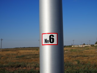 Number 26 on a silver post in the nature