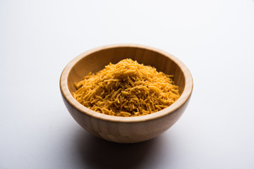 Aloo Bhujiya or Potato Bhujia also known as Namkeen sev. Popular Bikaneri recipe served in a bowl or plate. selective focus