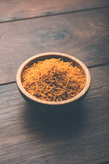 Aloo Bhujiya or Potato Bhujia also known as Namkeen sev. Popular Bikaneri recipe served in a bowl or plate. selective focus