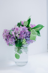 bouquet lilac flowers jar water isolated white