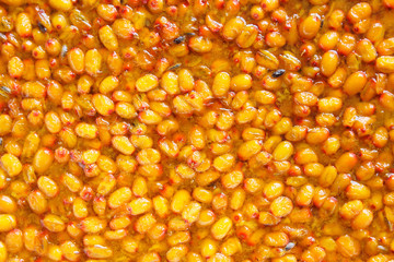 Fresh sea buckthorn jam. Close-up. Top view. Background. Texture.