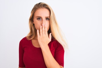 Young beautiful woman wearing red t-shirt standing over isolated white background cover mouth with hand shocked with shame for mistake, expression of fear, scared in silence, secret concept