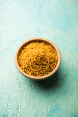 Aloo Bhujiya or Potato Bhujia also known as Namkeen sev. Popular Bikaneri recipe served in a bowl or plate. selective focus