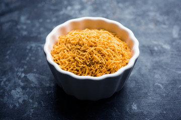 Aloo Bhujiya or Potato Bhujia also known as Namkeen sev. Popular Bikaneri recipe served in a bowl or plate. selective focus